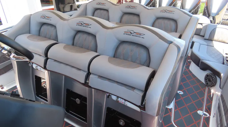 Slide: The Image of Luxury seating on a 2020 MTI 42V boat, featuring plush gray upholstery and modern design. - 18