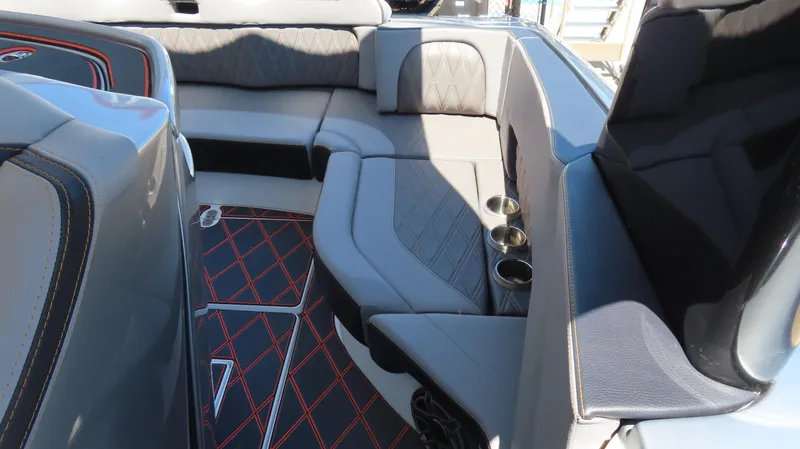 Slide: The Image of Luxurious interior of 2020 MTI 42V boat with sleek seating and cup holders. - 19