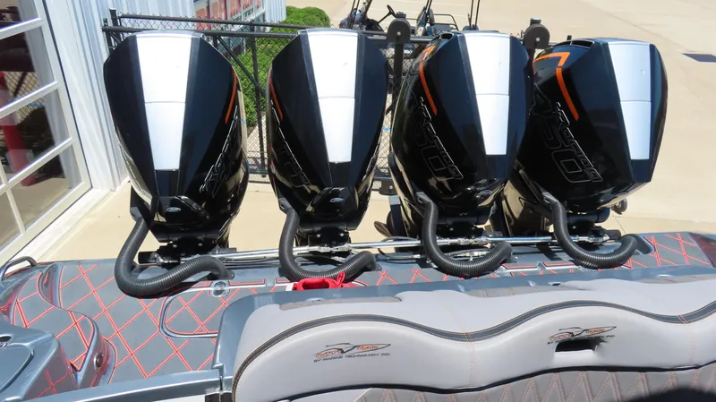 Slide: The Image of Four powerful outboard motors on a 2020 MTI 42V boat, showcasing sleek design and performance. - 8