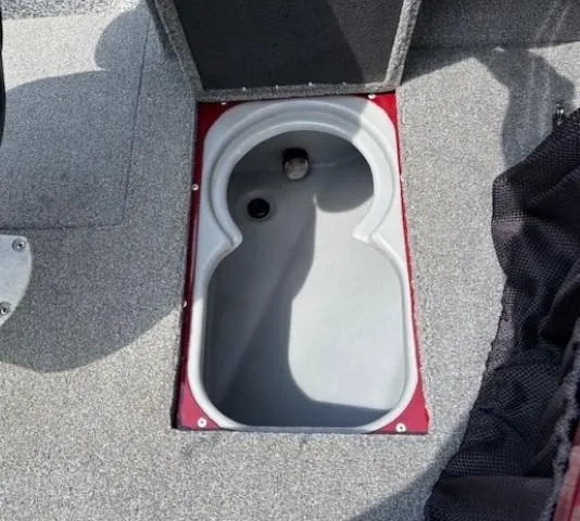 Slide: The Image of 2015 Tracker Targa V-18 Combo boat storage compartment with gray interior. - 12