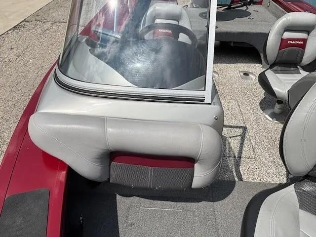 Slide: The Image of 2015 Tracker Targa V-18 Combo boat interior with seating and windshield. - 13