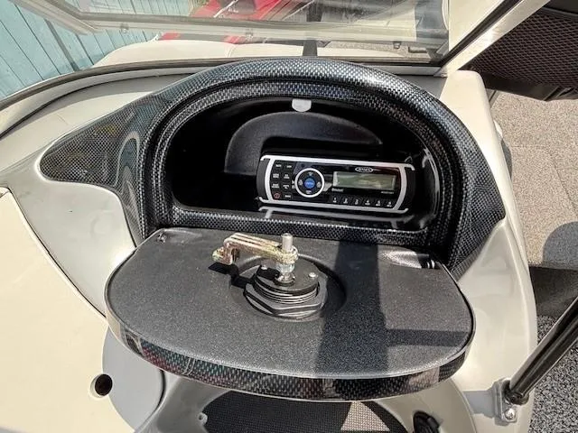 Slide: The Image of 2015 Tracker Targa V-18 Combo boat dashboard with stereo system and mount. - 17