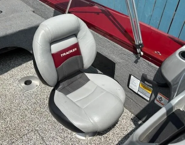 Slide: The Image of 2015 Tracker Targa V-18 Combo boat seat with gray and red upholstery. - 21