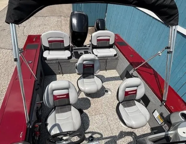Slide: The Image of 2015 Tracker Targa V-18 Combo boat interior with seating and steering wheel. - 28