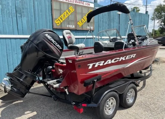 Slide: The Image of 2015 Tracker Targa V-18 Combo boat with Mercury engine, parked on a trailer. - 3