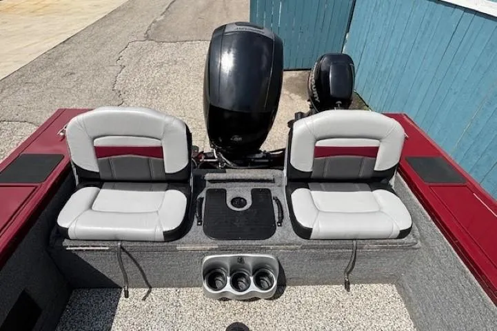 Slide: The Image of 2015 Tracker Targa V-18 Combo boat interior with dual seats and motor. - 30