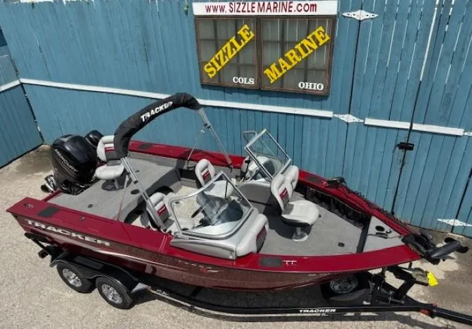 Slide: The Image of 2015 Tracker Targa V-18 Combo boat, red, parked at Sizzle Marine, Ohio. - 6