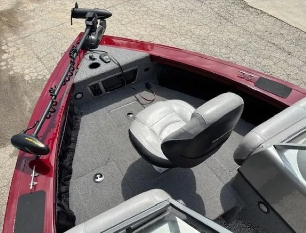 Slide: The Image of 2015 Tracker Targa V-18 Combo boat interior with gray seating and red trim. - 8