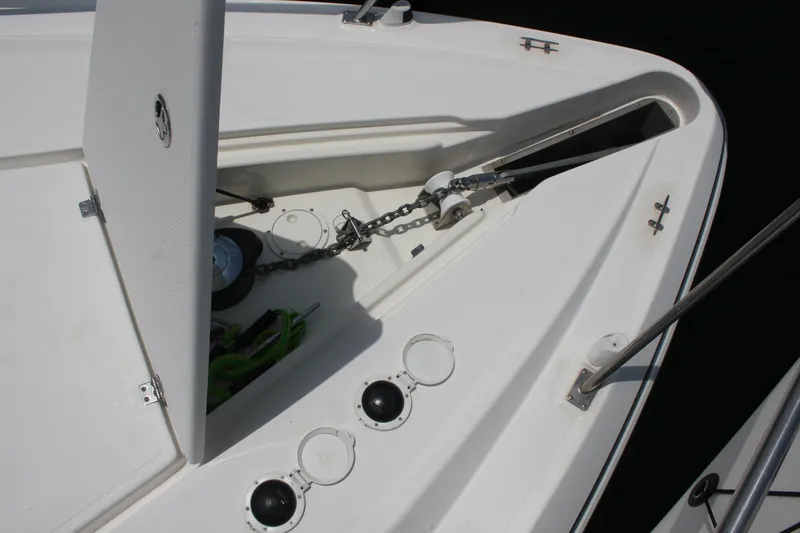 Slide: The Image of 2005 Cruisers Yachts 370 Express anchor locker with chain and storage compartments. - 14