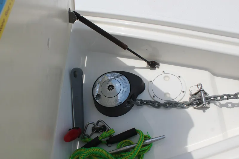 Slide: The Image of Anchor locker of 2005 Cruisers Yachts 370 Express with chain and tools. - 17