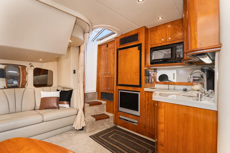 Slide: The Image of Luxurious interior of 2005 Cruisers Yachts 370 Express with modern kitchen and cozy seating. - 24