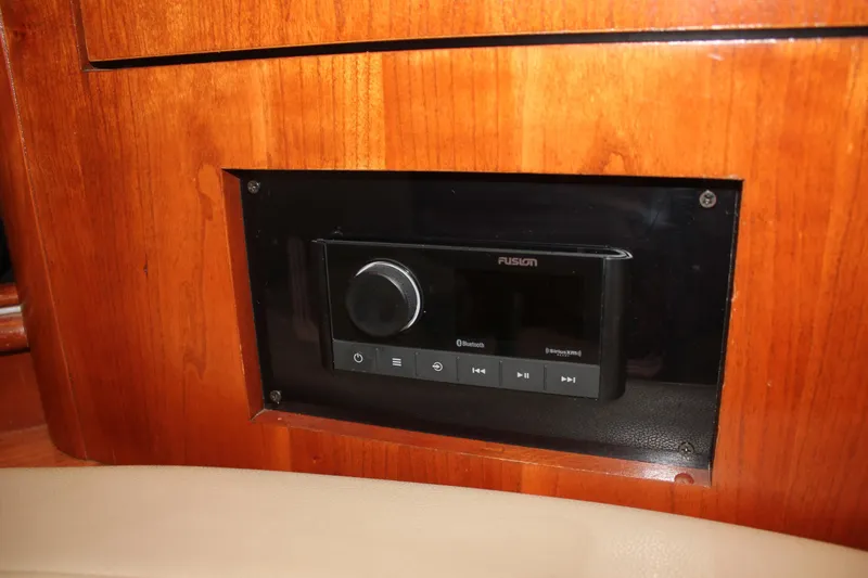 Slide: The Image of Fusion stereo system in 2005 Cruisers Yachts 370 Express, mounted on wooden panel. - 25