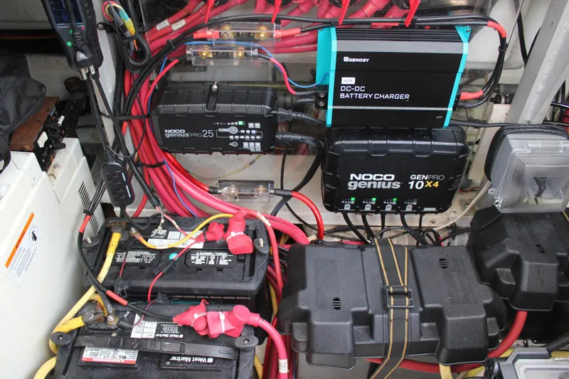 Slide: The Image of Battery setup in a 2005 Cruisers Yachts 370 Express with chargers and wiring. - 38