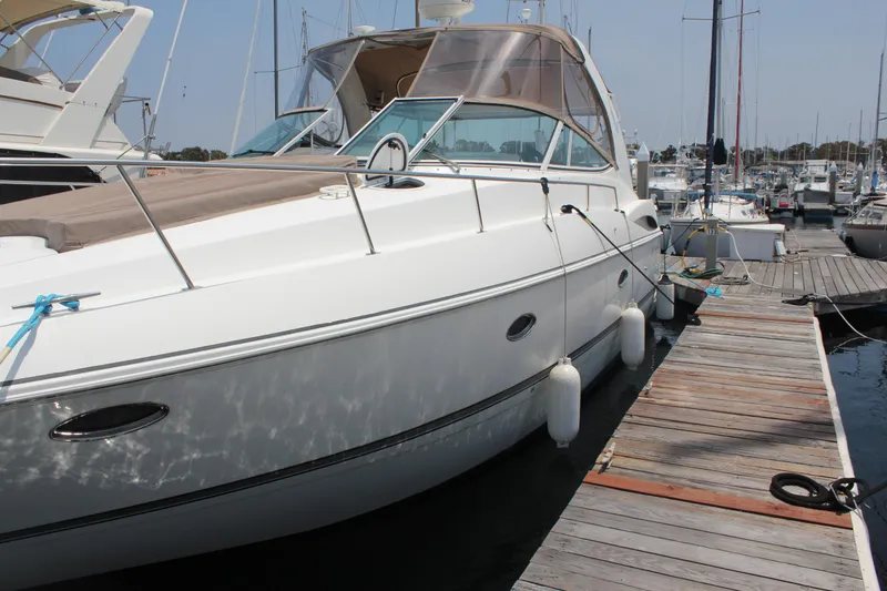 Slide: The Image of 2005 Cruisers Yachts 370 Express docked at marina, side view. - 4