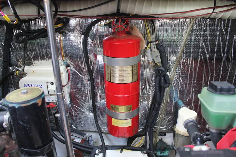 Slide: The Image of Engine room of 2005 Cruisers Yachts 370 Express with fire extinguisher and wiring. - 42