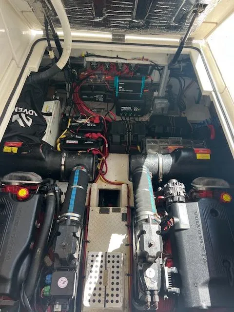 Slide: The Image of Engine compartment of 2005 Cruisers Yachts 370 Express, showcasing dual Volvo Penta engines. - 50