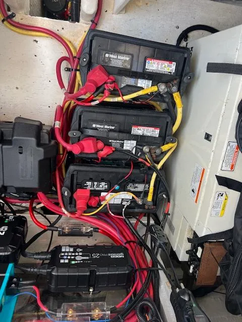 Slide: The Image of Battery setup in a 2005 Cruisers Yachts 370 Express engine compartment. - 53