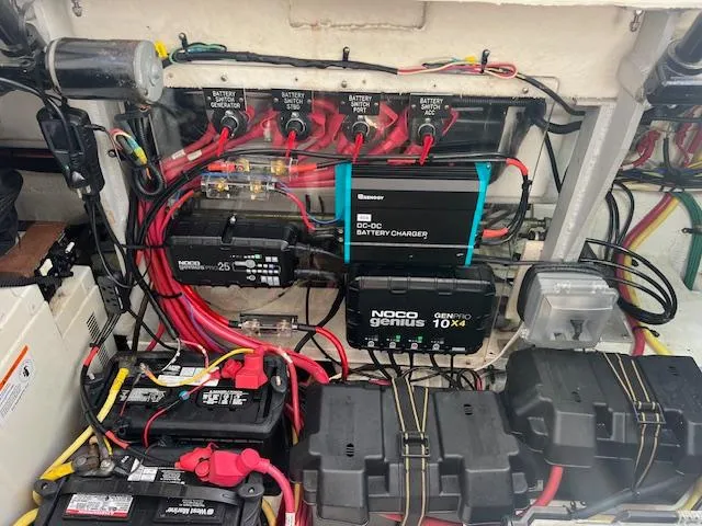 Slide: The Image of Electrical system of a 2005 Cruisers Yachts 370 Express with battery chargers and wiring. - 54
