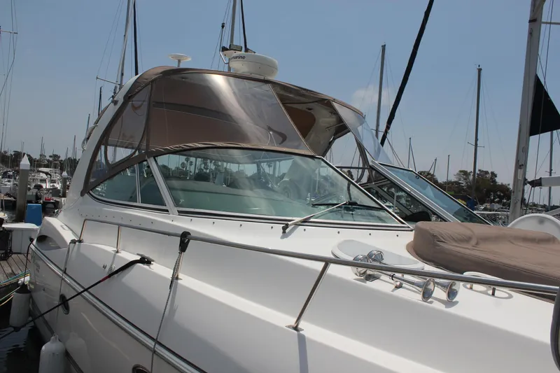 Slide: The Image of 2005 Cruisers Yachts 370 Express docked at marina, showcasing sleek design and luxury features. - 6