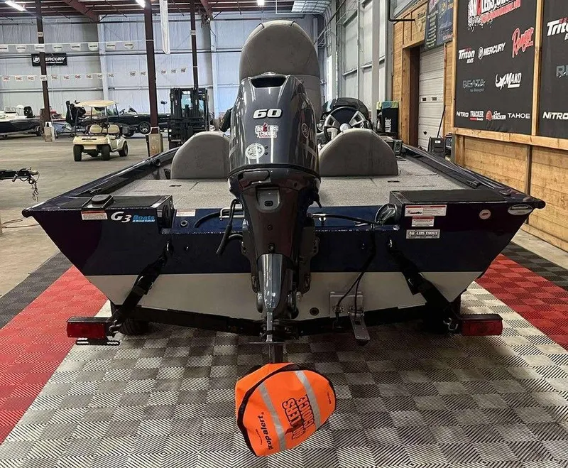 Slide: The Image of 2018 G3 Sportsman 17 boat with 60 HP motor in showroom. - 3