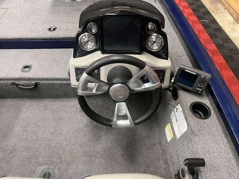 Slide: The Image of 2018 G3 Sportsman 17 boat dashboard with steering wheel and navigation system. - 4