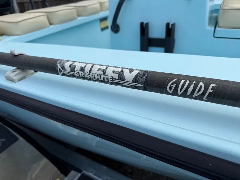 Slide: The Image of 2021 Hell's Bay Marquesa boat with Stiffy Graphite Guide pole on deck. - 17