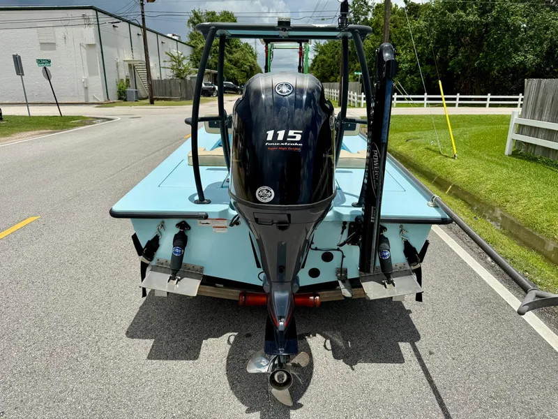 Slide: The Image of 2021 Hell's Bay Marquesa boat with Yamaha 115 engine on a street. - 3