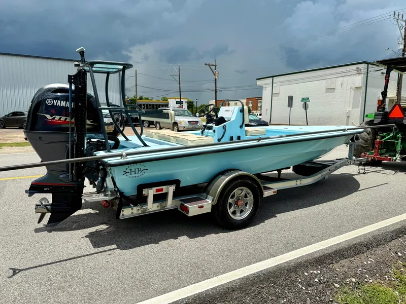 Slide: The Image of 2021 Hell's Bay Marquesa boat on trailer, Yamaha engine, parked on street. - 4