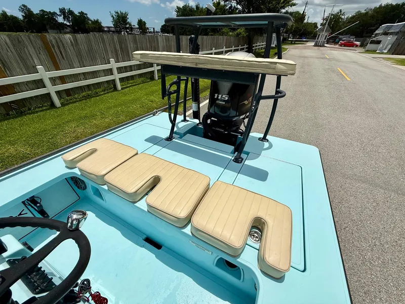 Slide: The Image of 2021 Hell's Bay Marquesa boat with Yamaha 115 engine, light blue deck, beige seating. - 8