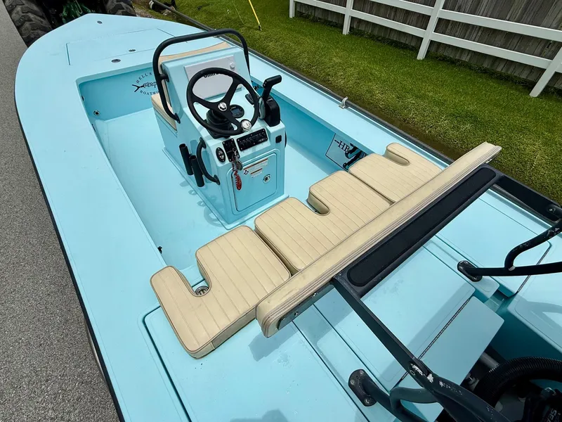 Slide: The Image of 2021 Hell's Bay Marquesa boat interior with steering console and beige seating. - 9