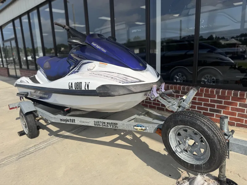 Slide: The Image of 2003 Yamaha WaveRunner FX140 on trailer, parked outside a building. - 6