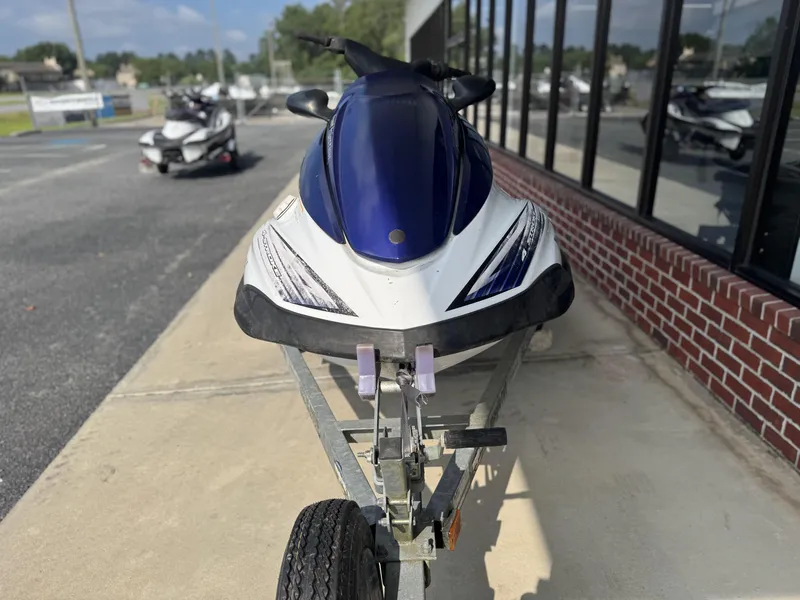 Slide: The Image of 2003 Yamaha WaveRunner FX140 on trailer, parked outside a building. - 7