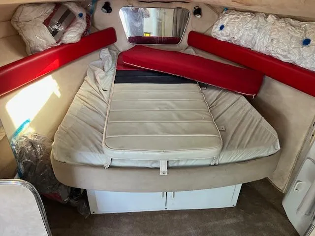 Slide: The Image of Interior cabin of a 1990 Donzi 300 Levante boat with red and white upholstery. - 12
