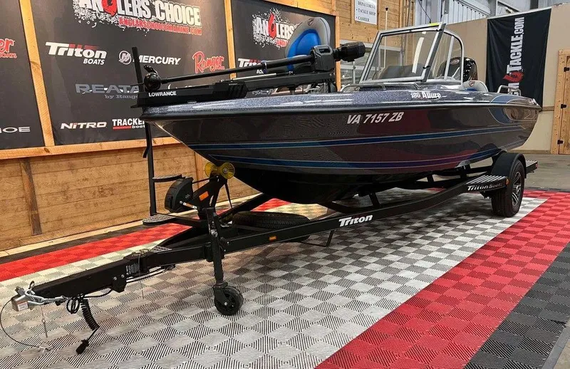 Slide: The Image of 2024 Triton 186 Allure boat on display, featuring sleek design and modern equipment. - 6