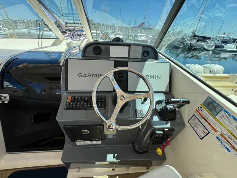 Slide: The Image of Helm of 2014 Pursuit 345 OS boat with Garmin navigation system. - 3