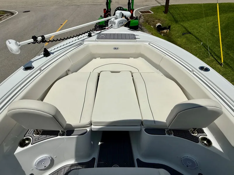 Slide: The Image of 2023 Sea Hunt Ultra 255 SE boat with spacious seating and modern design. - 14