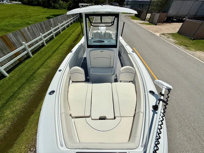 Slide: The Image of 2023 Sea Hunt Ultra 255 SE boat with spacious seating and sleek design. - 17