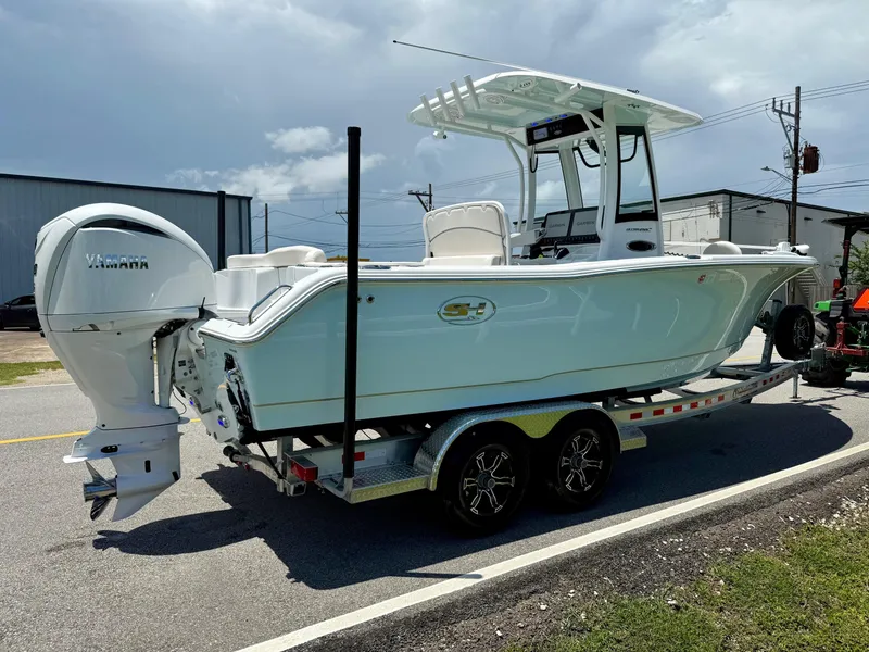 Slide: The Image of 2023 Sea Hunt Ultra 255 SE boat on trailer, featuring Yamaha outboard engine. - 4