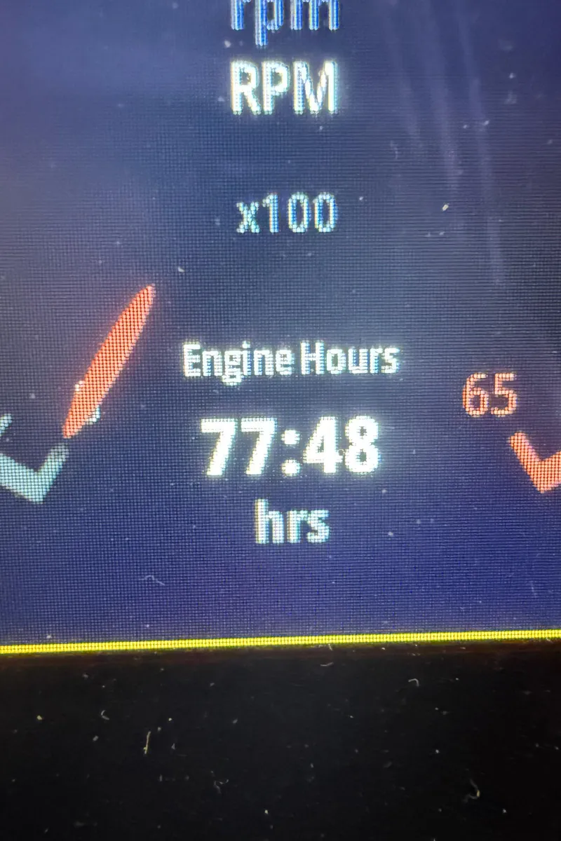 Slide: The Image of Display showing 77:48 engine hours on 2023 Chaparral 21 Surf boat. - 13