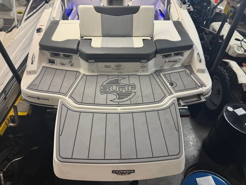 Slide: The Image of 2023 Chaparral 21 Surf boat with spacious swim platform and modern design. - 19