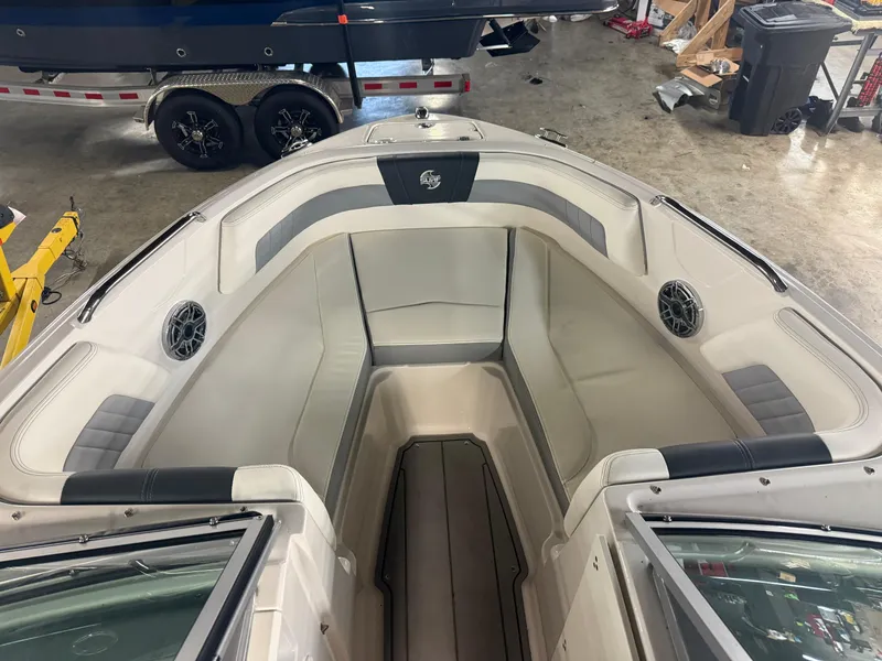 Slide: The Image of 2023 Chaparral 21 Surf boat interior with spacious seating and modern design. - 2