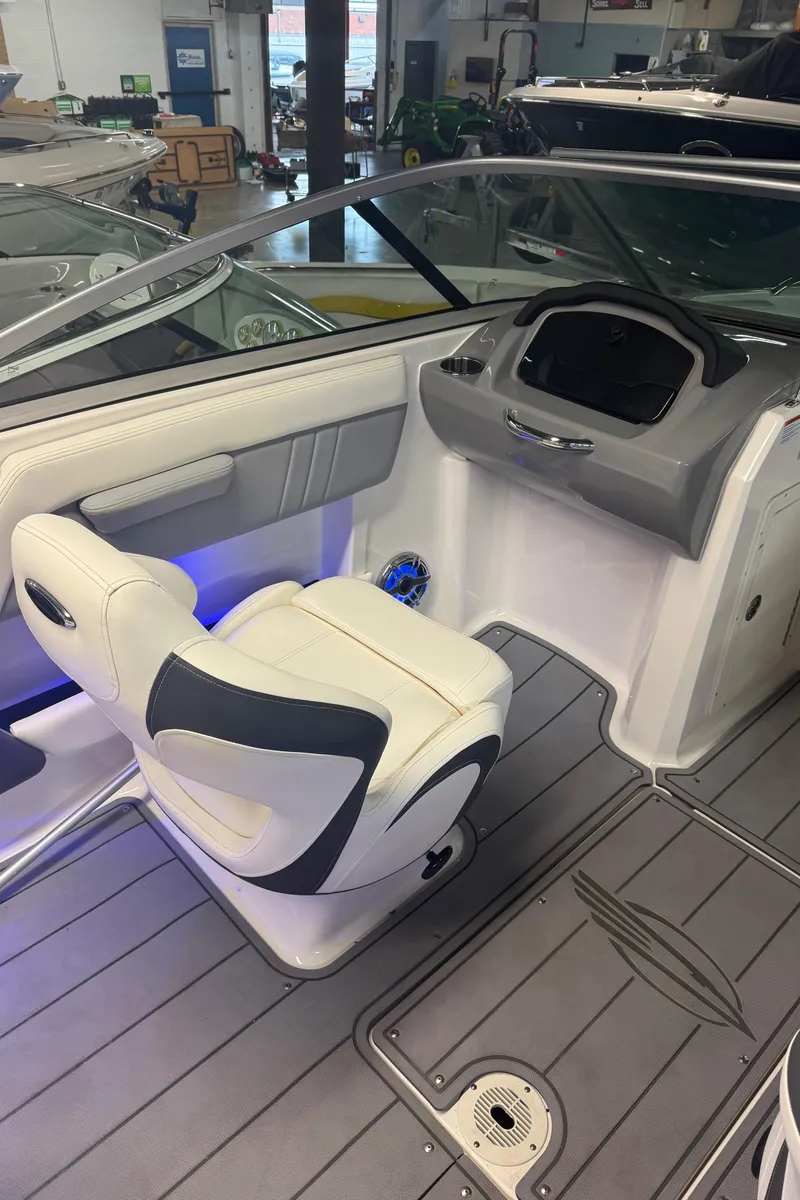 Slide: The Image of 2023 Chaparral 21 Surf boat interior with modern dashboard and seating. - 8