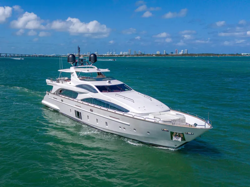 Slide: The Image of Luxurious 2012 Azimut Grande 105 yacht cruising on clear blue waters under a sunny sky. - 17