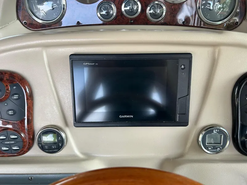 Slide: The Image of Dashboard of a 2002 Sea Ray 300 Sundancer with Garmin GPSMAP display. - 16