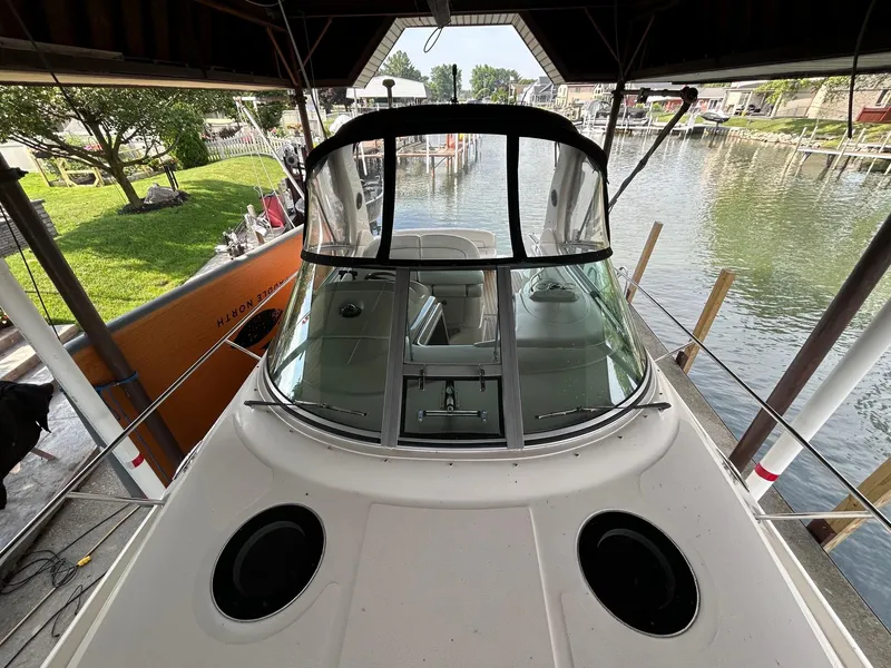 Slide: The Image of 2002 Sea Ray 300 Sundancer docked in a marina, view from above. - 26