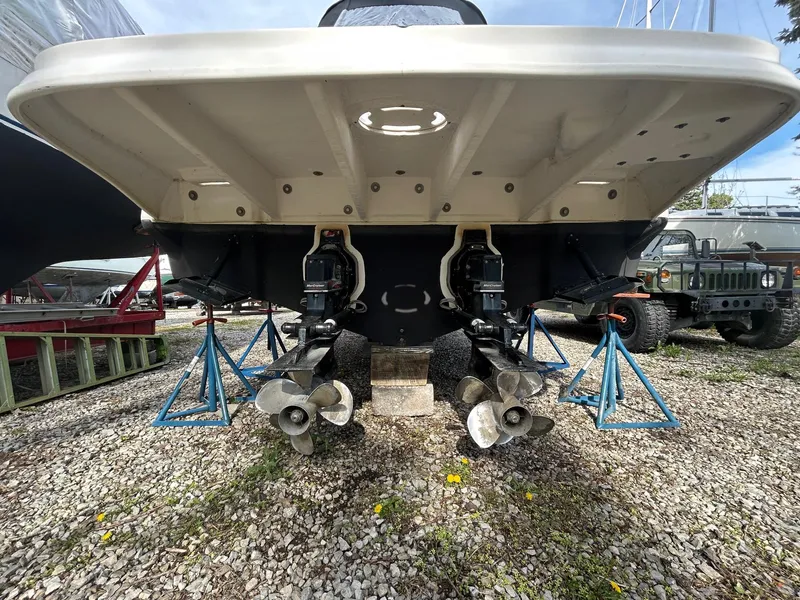 Slide: The Image of Rear view of 2002 Sea Ray 300 Sundancer on stands, showing dual propellers. - 28