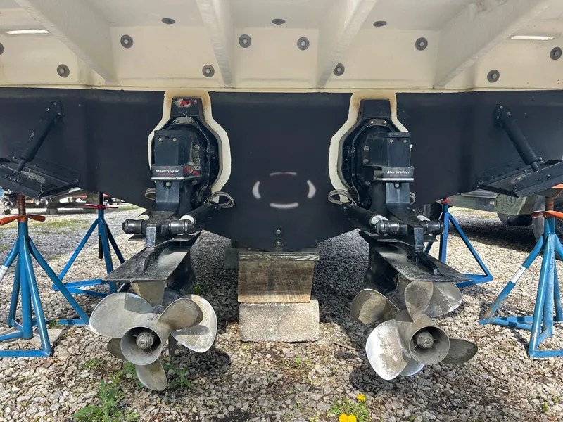 Slide: The Image of 2002 Sea Ray 300 Sundancer boat with dual MerCruiser outdrives on stands. - 29