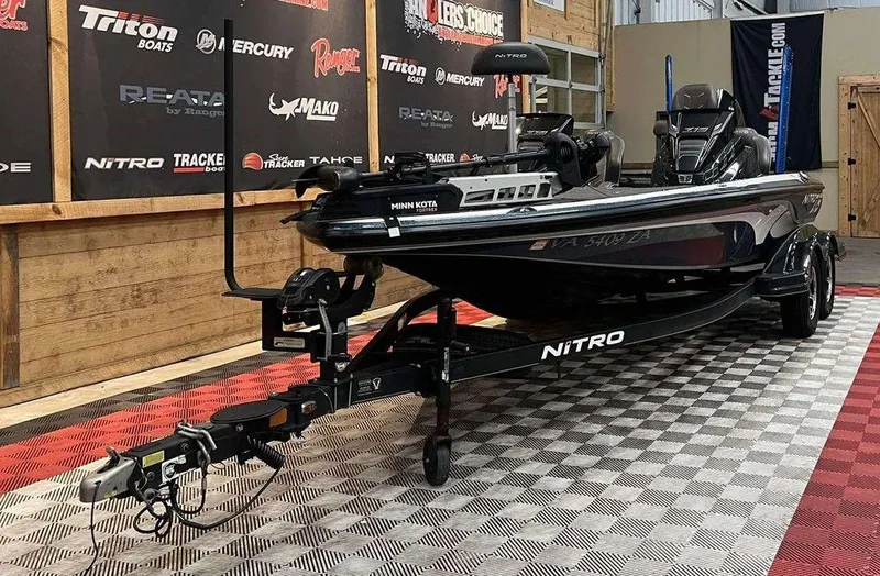 Slide: The Image of 2020 Nitro Z19 Pro boat on display in showroom with branded backdrop. - 3