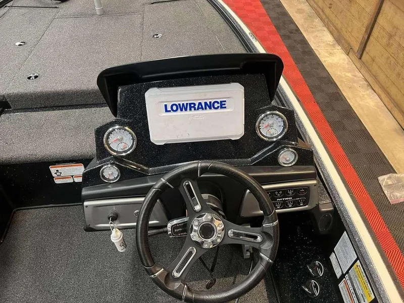 Slide: The Image of 2020 Nitro Z19 Pro boat dashboard with Lowrance display and steering wheel. - 5