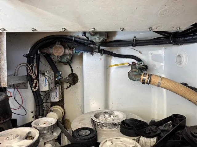 Slide: The Image of Engine compartment of a 2009 Formula 400ss boat, showing hoses and mechanical components. - 13